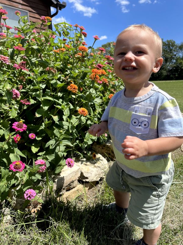 Campbell Loves to Smell the Flowers in Grandma's Garden