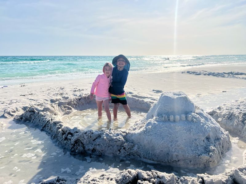 So Proud of their Creation in the Sand!