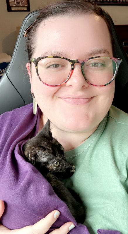 Holding a Friend's Kitten in a Baby Carrier