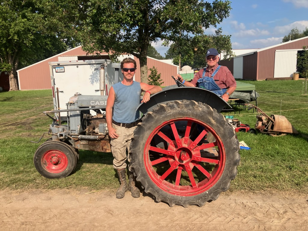 Destry at a Tractor Show with His Grandpa