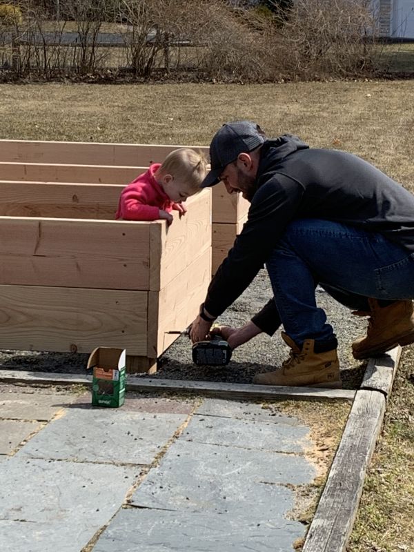Avery Watching Erik Build Our Garden!!