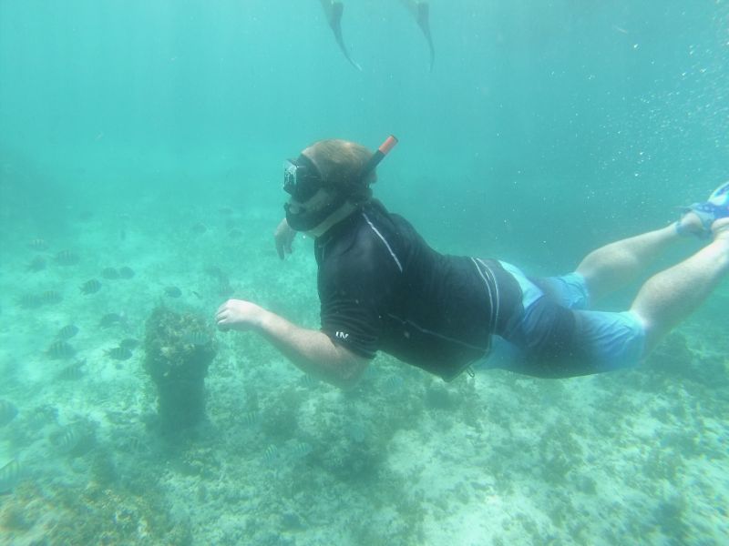 Andrew Looking for Tropical Fish While Snorkeling in the Ocean